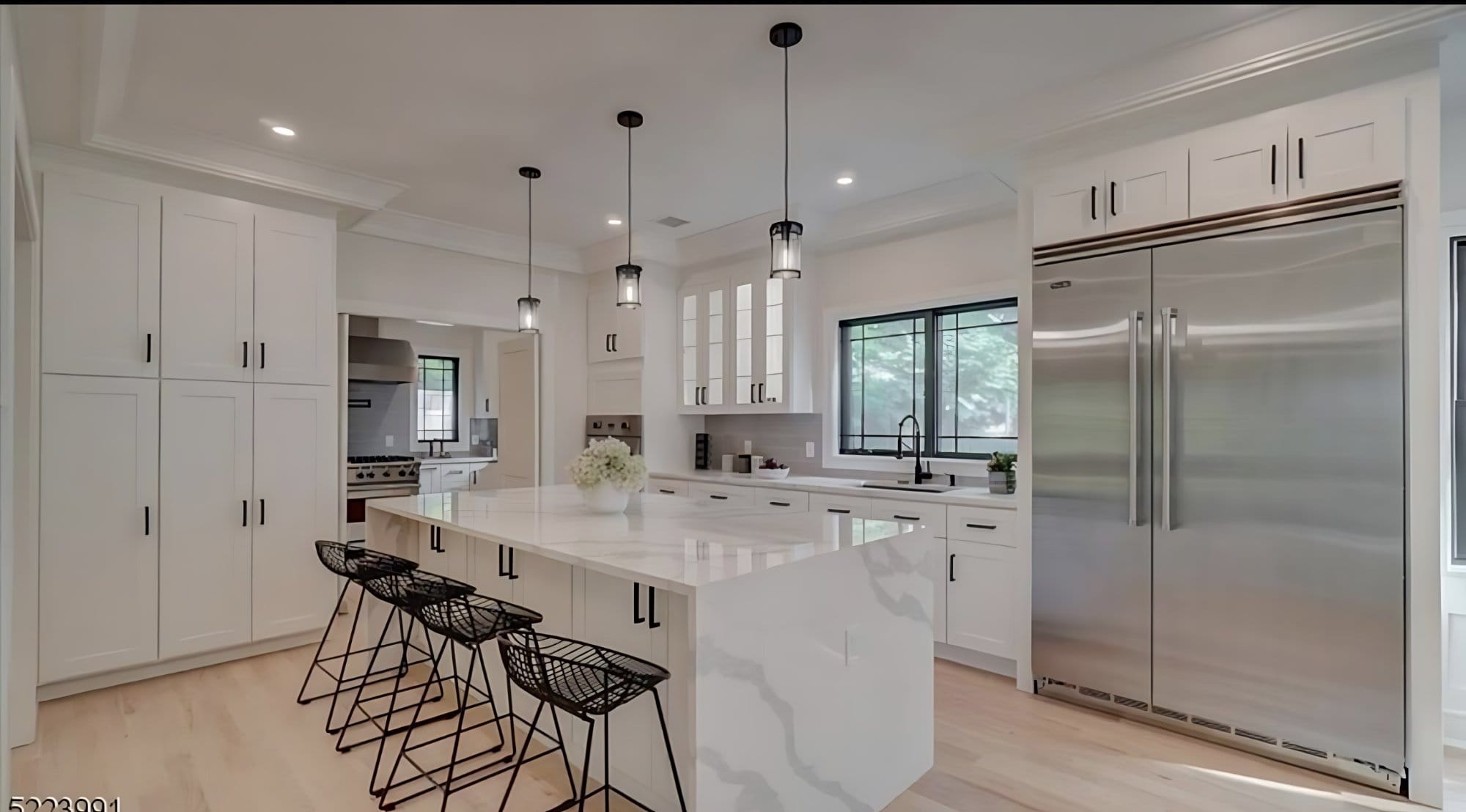 Kitchen with Calacatta island and bar seating