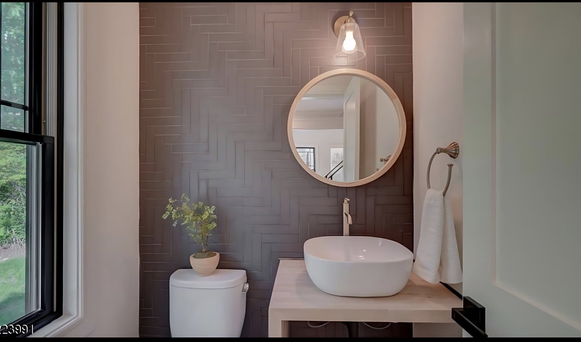 Powder room with herringbone tile accent wall