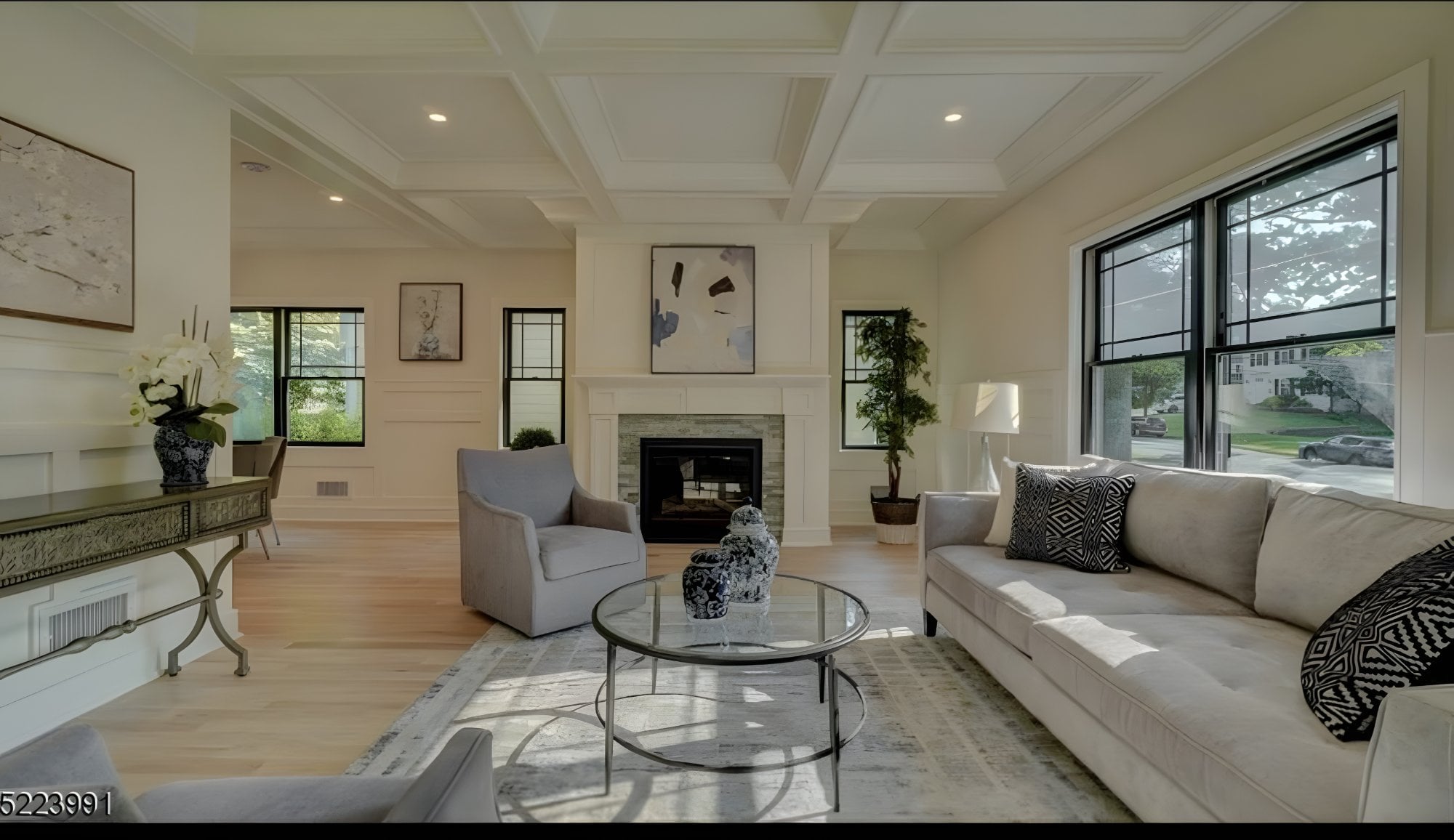 Living room with coffered ceiling and fireplace